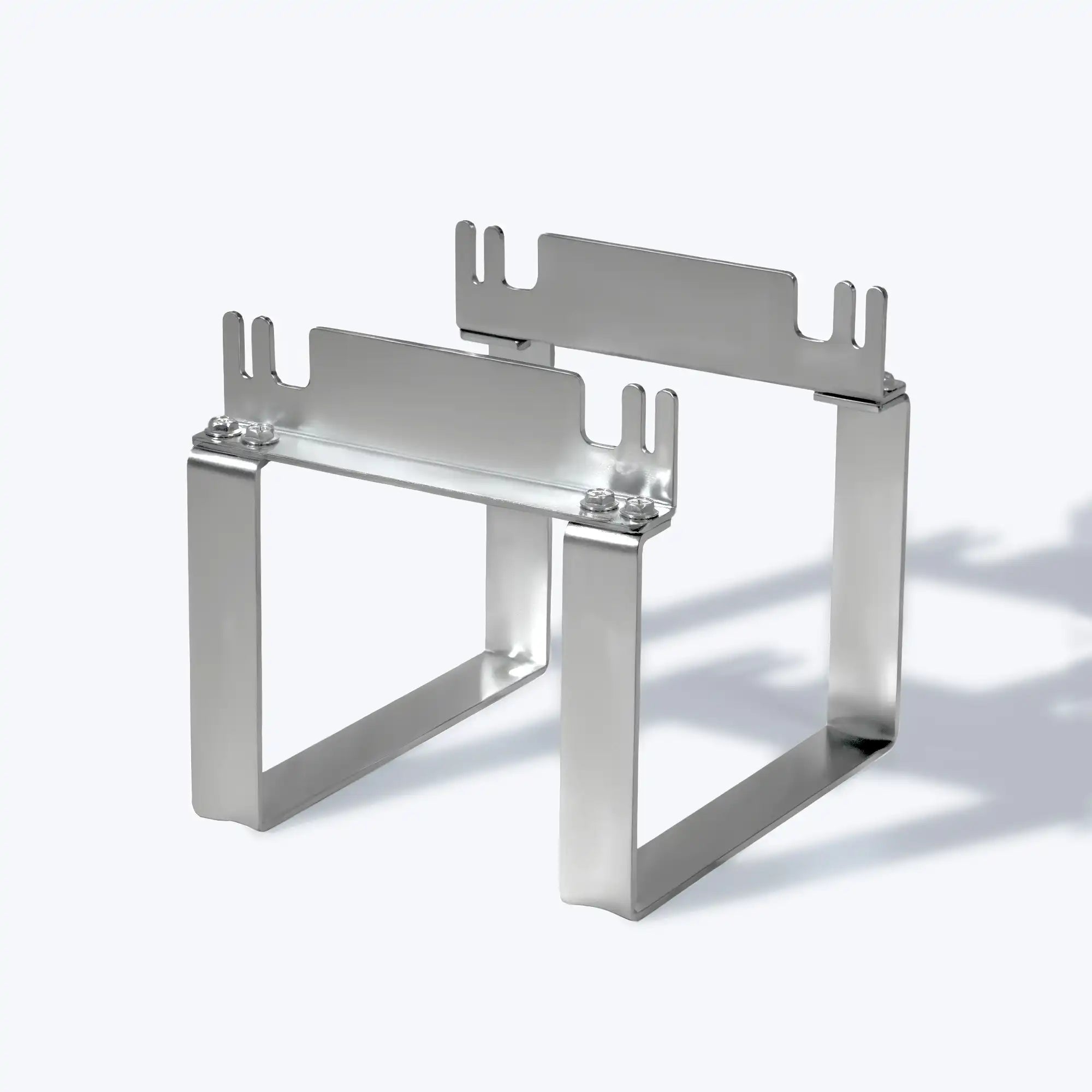 Metal polaflex mole trap releaser on a white background
